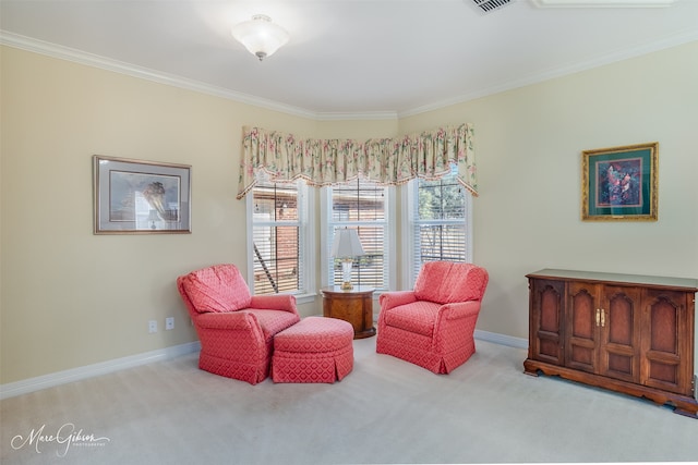 sitting room with ornamental molding, carpet flooring, visible vents, and baseboards