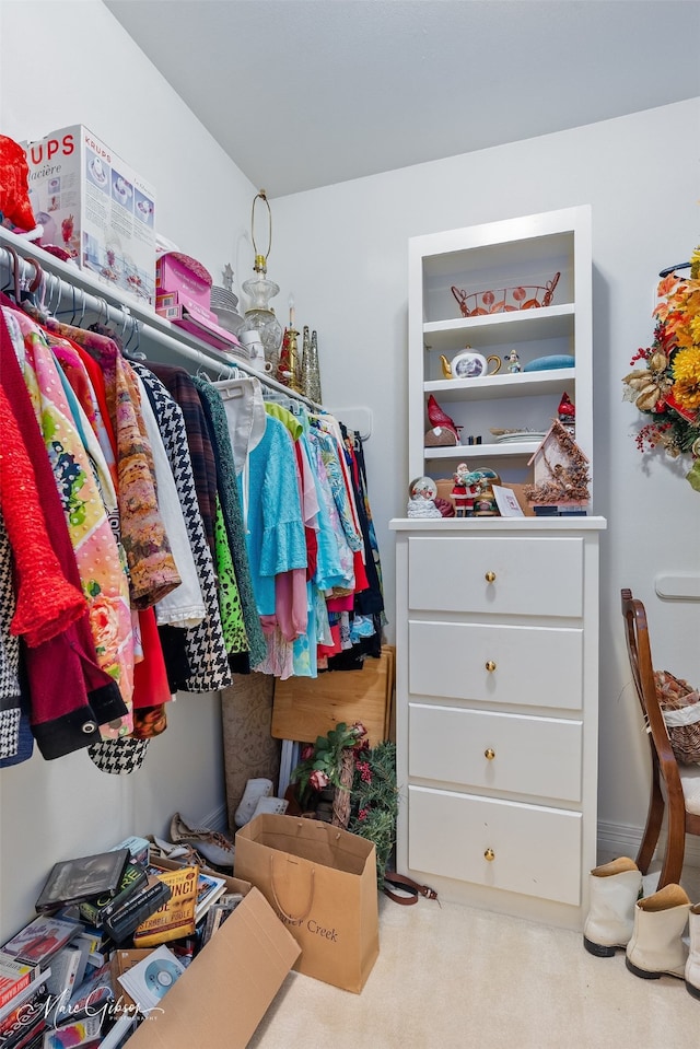 walk in closet featuring carpet