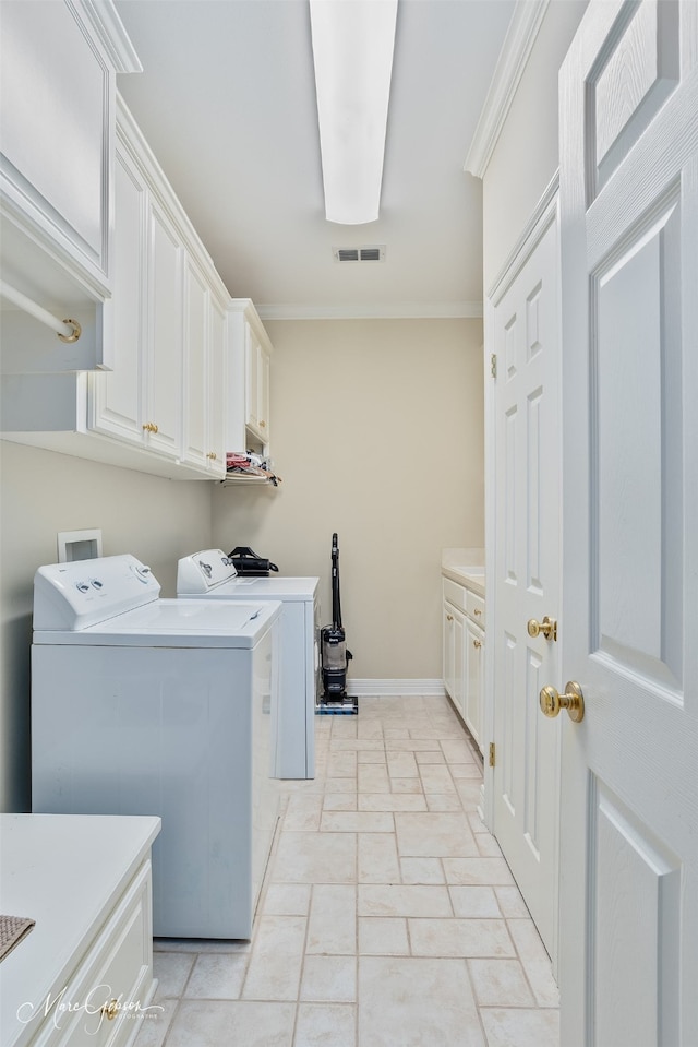 101 Chesterton Ct, Bossier City, LA 71111 - laundry area with cabinet space, washing machine and clothes dryer, crown molding, and baseboards
