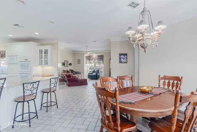 dining space featuring recessed lighting, visible vents, crown molding, and a notable chandelier