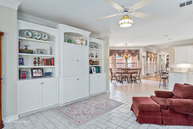 living area featuring ceiling fan with notable chandelier, visible vents, and crown molding