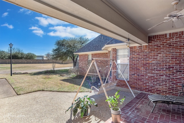 exterior space featuring a patio area and a ceiling fan