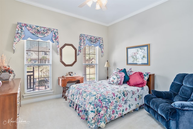 bedroom with a ceiling fan, light carpet, crown molding, and baseboards