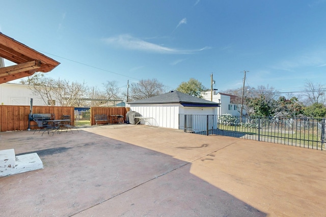 view of patio / terrace featuring a grill and fence