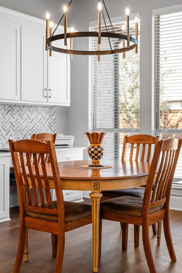 dining space with wood finished floors