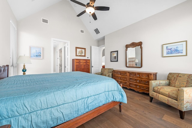 bedroom featuring arched walkways, wood finished floors, and visible vents