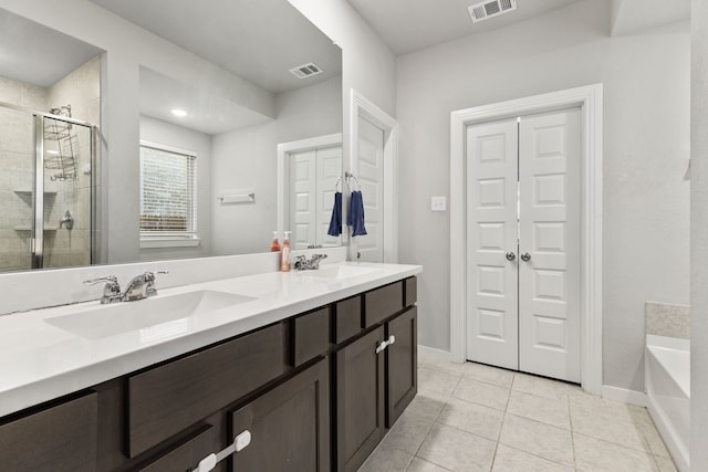 full bathroom featuring a shower stall, visible vents, and a sink