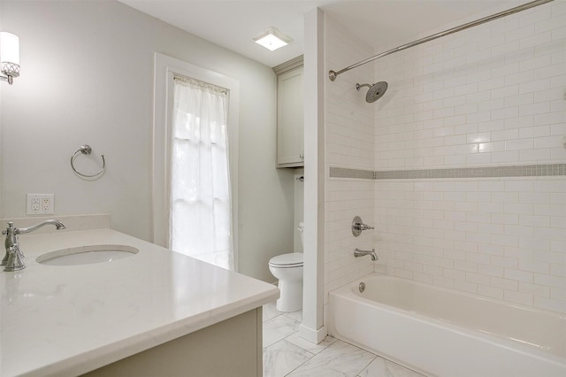 bathroom with toilet, marble finish floor, shower / tub combination, and vanity