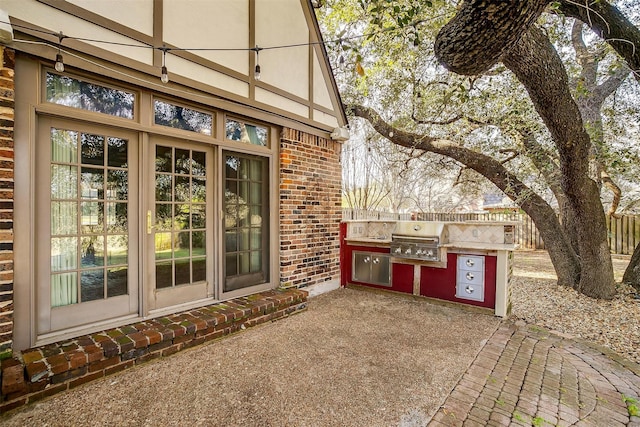 exterior space featuring fence, grilling area, and area for grilling