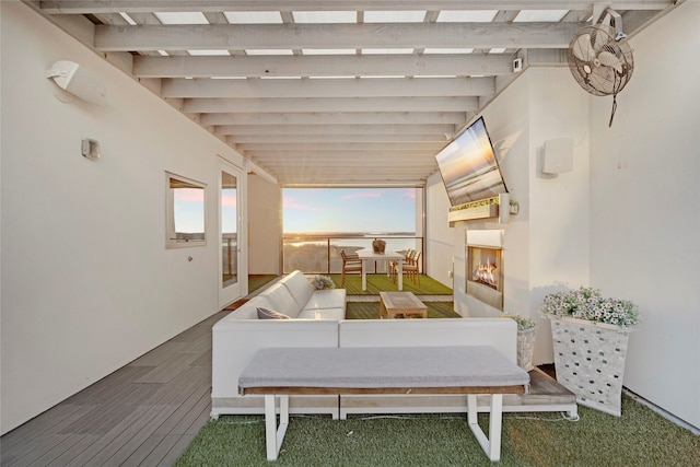 view of patio with an outdoor living space with a fireplace