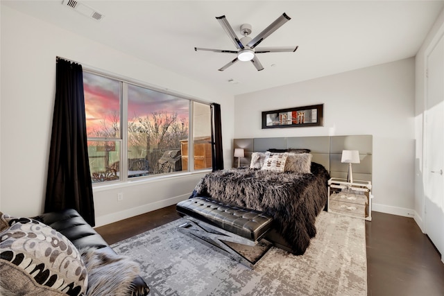 bedroom featuring visible vents, baseboards, and ceiling fan