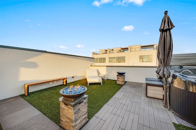 deck featuring an outdoor fire pit