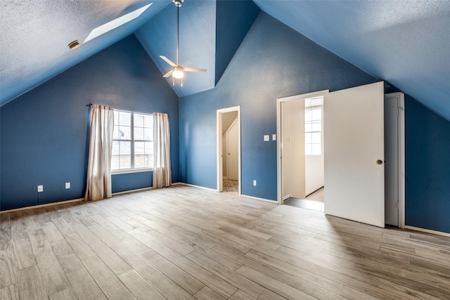 bonus room featuring a ceiling fan, a textured ceiling, and wood finished floors