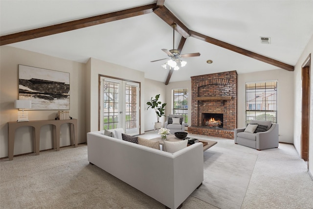 1878 Trail Ridge Dr, Lewisville, TX 75077 - living room featuring light carpet, a brick fireplace, a ceiling fan, and french doors