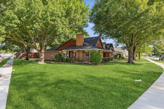 1878 Trail Ridge Dr, Lewisville, TX 75077 - view of front of property with a chimney and a front yard