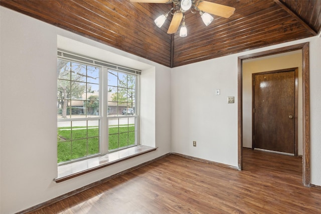 1878 Trail Ridge Dr, Lewisville, TX 75077 - empty room featuring wooden ceiling, lofted ceiling, ceiling fan, wood finished floors, and baseboards
