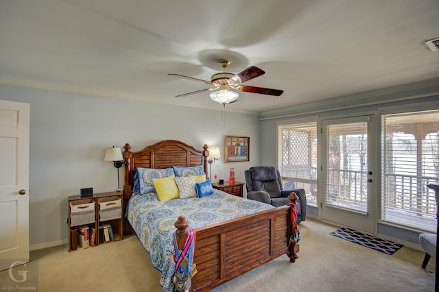 carpeted bedroom featuring access to exterior, visible vents, ornamental molding, ceiling fan, and baseboards