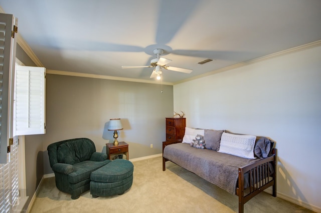 sitting room with carpet, visible vents, ornamental molding, ceiling fan, and baseboards