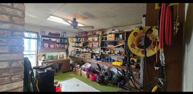 storage area featuring a ceiling fan and visible vents