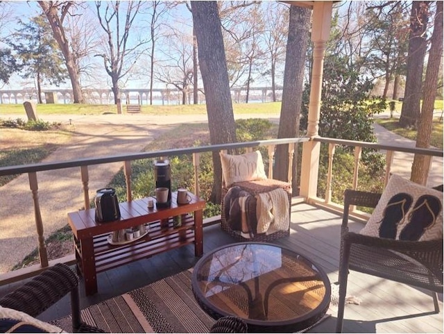 wooden terrace featuring outdoor dining space