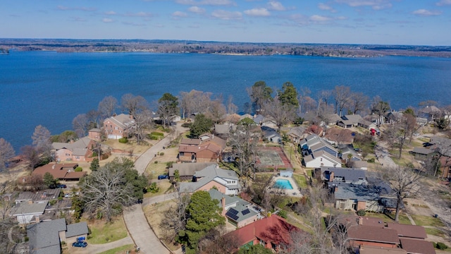 drone / aerial view featuring a water view and a residential view