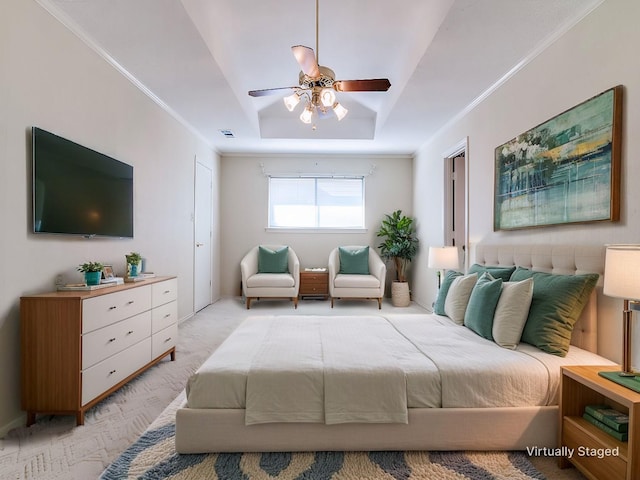 bedroom with light carpet, visible vents, a raised ceiling, and crown molding