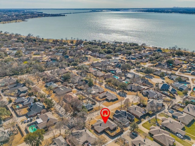 bird's eye view featuring a water view and a residential view