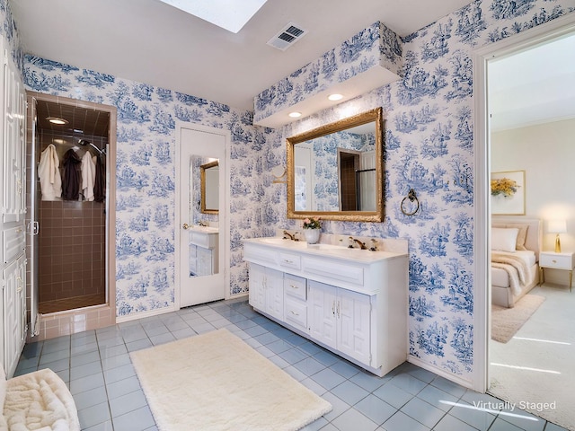 bathroom featuring wallpapered walls, visible vents, baseboards, ensuite bathroom, and tile patterned flooring