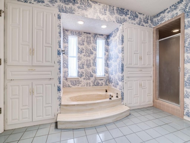 full bathroom featuring a stall shower, a bath, and wallpapered walls