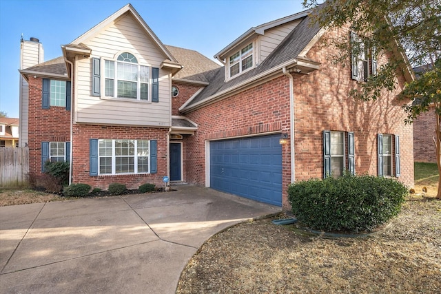 view of front of house with concrete driveway, brick siding, and an attached garage