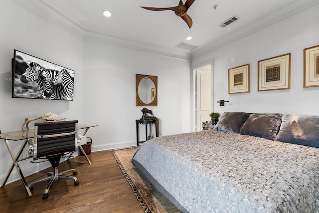 bedroom with dark wood-style floors, visible vents, crown molding, and baseboards