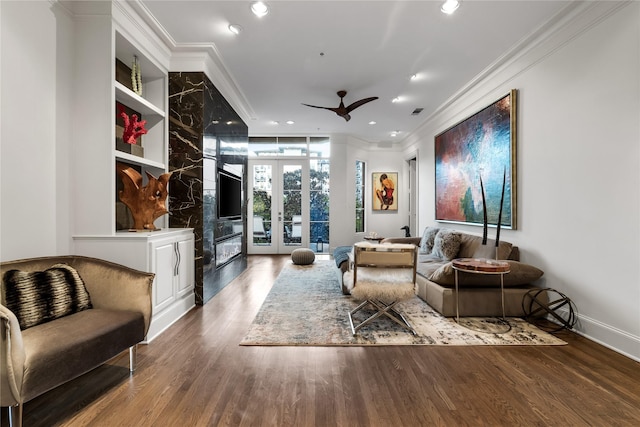 living area with ornamental molding, french doors, wood finished floors, and recessed lighting