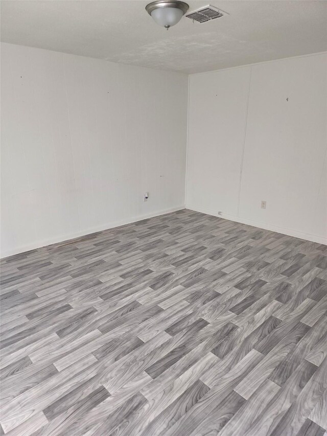 unfurnished bedroom with multiple windows, carpet flooring, and baseboards