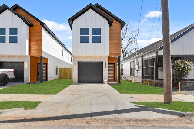 view of front of house with an attached garage, brick siding, driveway, board and batten siding, and a front yard