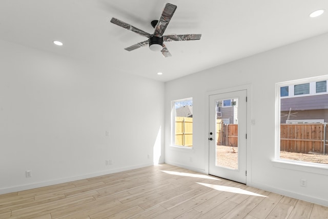 unfurnished room with light wood-type flooring, baseboards, a ceiling fan, and recessed lighting