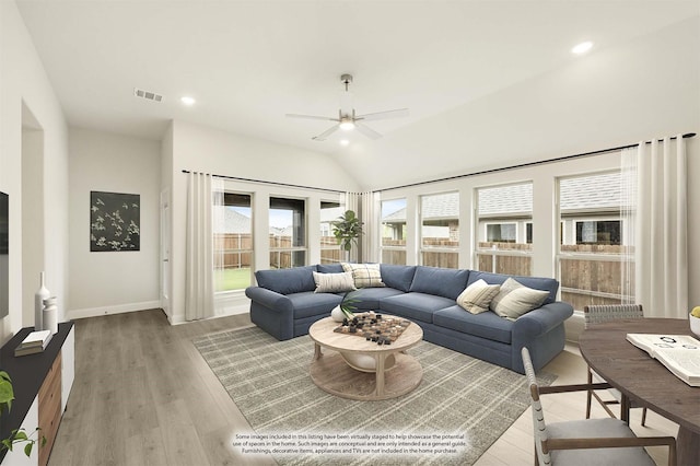 119 Emperor Oak Ct, Balch Springs, TX 75181 - living room featuring healthy amount of natural light, a ceiling fan, light wood-style floors, baseboards, and vaulted ceiling