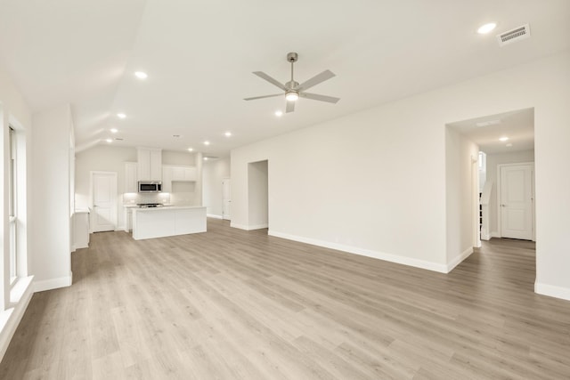 119 Emperor Oak Ct, Balch Springs, TX 75181 - unfurnished living room featuring recessed lighting, ceiling fan, light wood finished floors, baseboards, and lofted ceiling