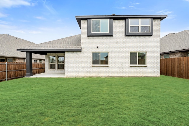 119 Emperor Oak Ct, Balch Springs, TX 75181 - back of property with brick siding, a patio area, and roof with shingles