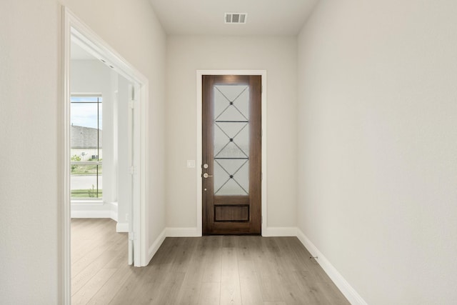 119 Emperor Oak Ct, Balch Springs, TX 75181 - doorway to outside with light wood-style flooring and baseboards