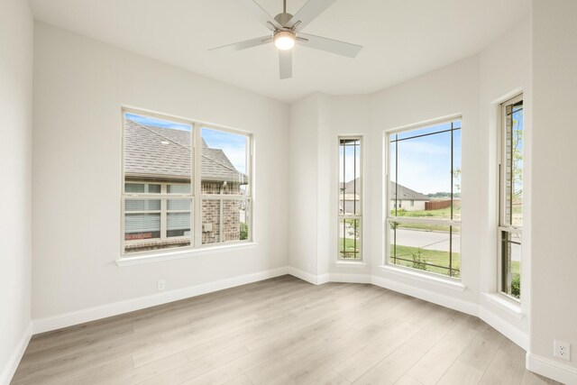 119 Emperor Oak Ct, Balch Springs, TX 75181 - spare room with light wood-style floors, baseboards, and a ceiling fan