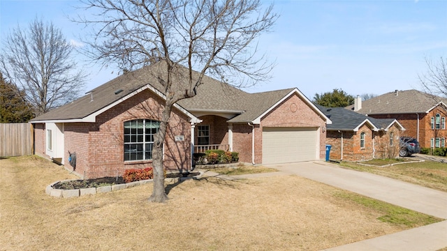 ranch-style house featuring an attached garage, brick siding, fence, concrete driveway, and a front lawn