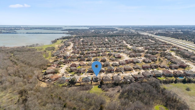 bird's eye view featuring a water view and a residential view