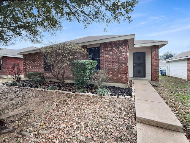 single story home with brick siding