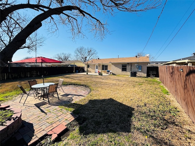 view of yard featuring a fenced backyard and a patio