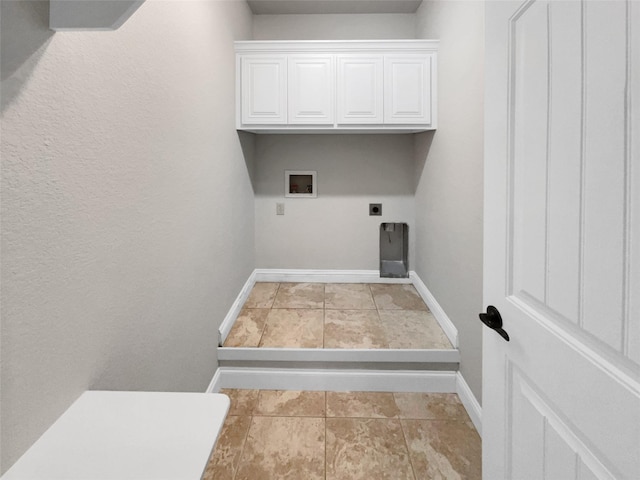 laundry room with washer hookup, cabinet space, electric dryer hookup, and baseboards