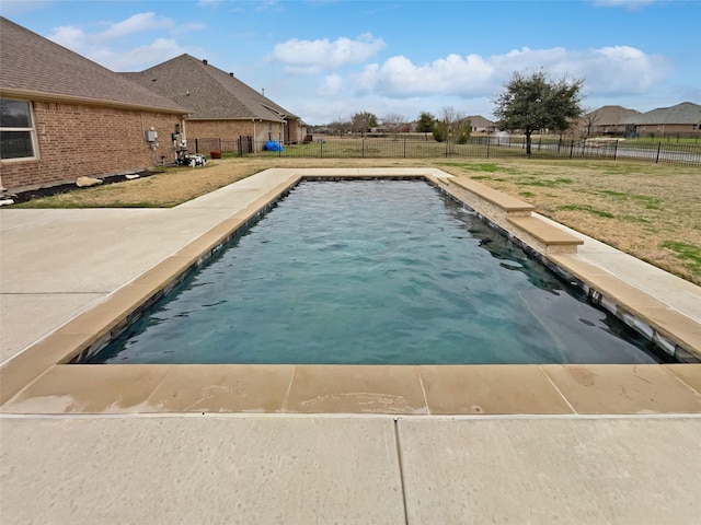 view of swimming pool featuring a fenced backyard, a fenced in pool, and a yard