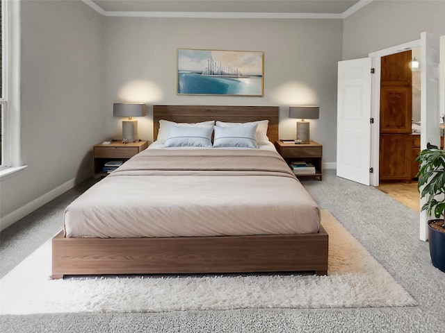 carpeted bedroom featuring ornamental molding and baseboards