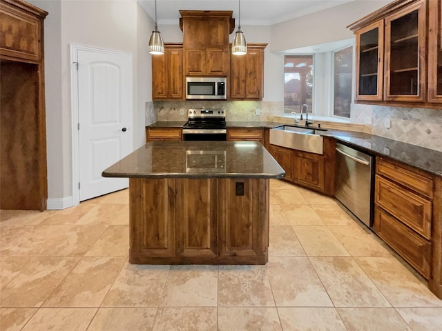 kitchen featuring decorative backsplash, appliances with stainless steel finishes, ornamental molding, a sink, and dark stone countertops