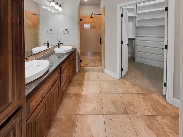 full bathroom featuring a sink and a shower stall