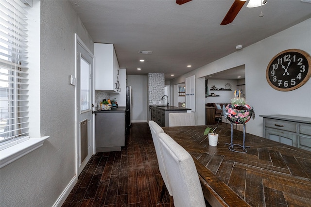 dining room featuring baseboards, visible vents, ceiling fan, dark wood-type flooring, and recessed lighting